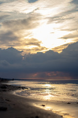 Sea ocean landscape at sunset with volumetric light (god rays) Baltic shore coast at dusk