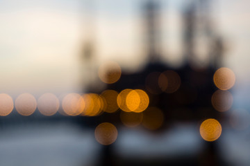 Out of focus image of offshore production platforms complex connected with bridges at oil field