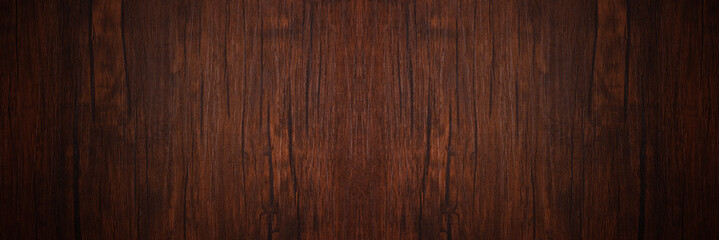 Seamless dark brown wooden board texture background with vignette
