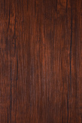 Naklejka premium Seamless dark brown wooden board texture background with vignette