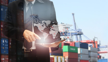Double exposure of man with world map for logistic network distribution on background and Logistics...