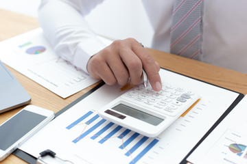 Businessmen use graphs to summarize results and calculate income-expenses to find financial balance points and use them to improve and advance business, finance and economic concepts.