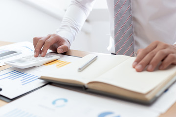 Businessmen use graphs to summarize results and calculate income-expenses to find financial balance points and use them to improve and advance business, finance and economic concepts.