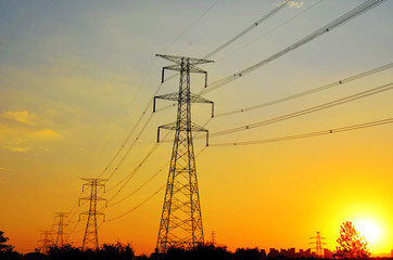 High voltage tower in the setting sun