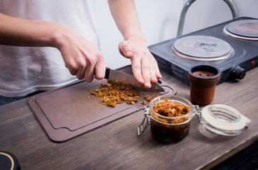 Cooking hookah in the bar. Cutting tobacco into a bowl. Restaurant