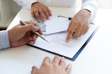  Businessmen make dollar payments while signing an investment agreement to be a partner in an illegal and successful manner, Bribery and corruption concept..