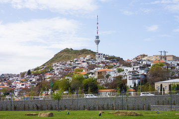 Fototapeta premium Panorama of the city of Baku, the capital of the Republic of Azerbaijan. Old houses built on a mountain on the outskirts of the city. The houses are built up on the hill in form of terraces.
