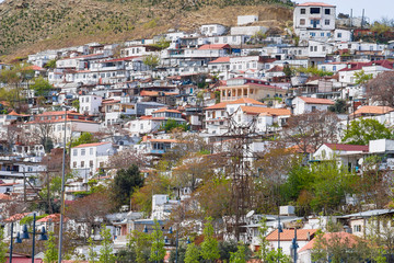 Fototapeta na wymiar Panorama of the city of Baku, the capital of the Republic of Azerbaijan. Old houses built on a mountain on the outskirts of the city. The houses are built up on the hill in form of terraces.