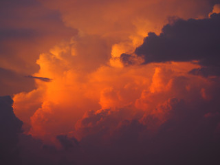 Thunderstorm Clouds Reflecting Golden Sunrise at Gulf of Mexico