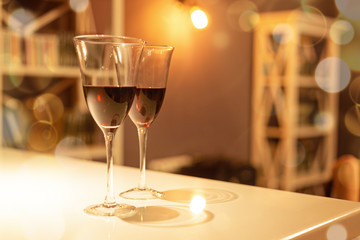 Two glasses of red wine in a cozy interior