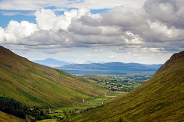 Green hills sweeping down to a valley below