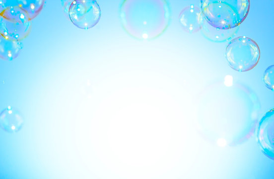 Colorful of soap bubbles float on a white background  with copy space 