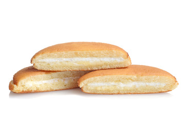 three slices of vanilla sponge cake with cream filling