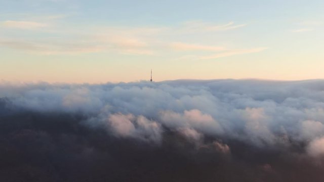 TV tower with cloudy and foggy sky