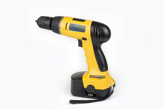 Cordless aku drill on the white