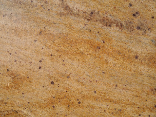 Marble surface in ocher. Background, texture.