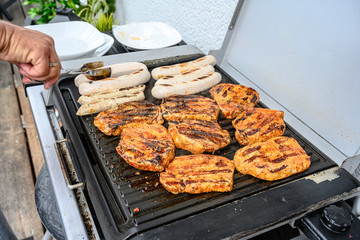 Barbecue grill bbq on coal charcoal grill with steaks bratwurst sausages and meat delicious summer meal