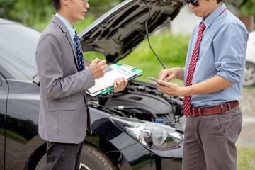 Insurance agent check for damaged cars for car insurance customer. Car insurance concept.