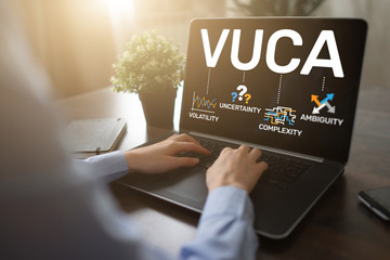 VUCA world concept on screen. Volatility, uncertainty, complexity, ambiguity.