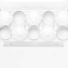 White chicken eggs in white packaging on light background top view flat lay copy space. Eggs in box, natural healthy food and organic farming concept. Creative food minimalistic background, Easter