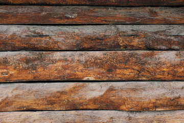 Dark wooden fence. Shabby table, dirty pine lumber. Old wood boards.