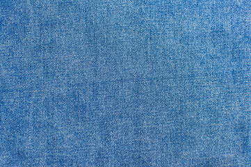 Texture of blue denim closeup. Abstract denim fabric texture. Women's or men's trend clothing,...