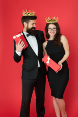 Beautiful people celebrate success. Couple in love wear crowns red background. Enjoying success. Gifted for achievements. Pride and pleasure. Successful and proud. Victory and triumph. Success goal