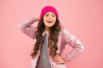 Winter activities. little girl puffer jacket and knitted hat. health care in cold weather. good...