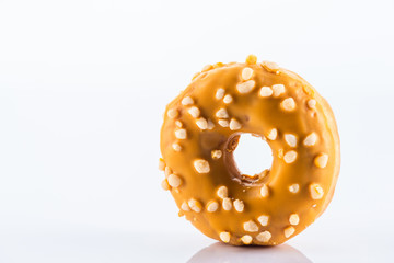 Single Salted Caramel Donut or Doughnut. Studio Photo on White Background, Close Up view