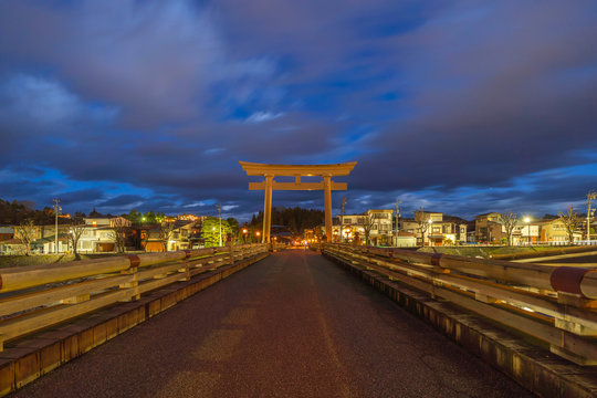 Japanese Torii pole at Miyamae Bridge at night in Takayama old town, Gifu, urban city in Japan. Architecture background.