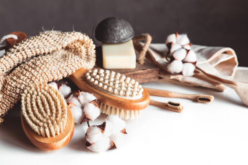 Natural brushes made of wood and soap on the background of concrete, bamboo toothbrushes PNOV2019