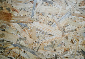 Abstract raw material recyclable sawdust background, light brown wooden texture