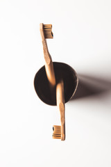 Wooden bamboo toothbrushes on white background isolated. The concept of zero waste, recycling