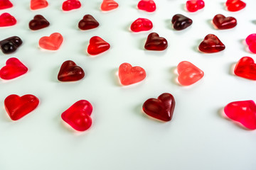 Heart shaped jelly candies on white background