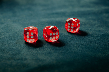Red dice on the table. Three dice with sixes. Concept for casino games or gambling