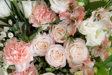 Floral arrangement in pastel colors. Bouquet of different flowers. peach fuzz - color of the year 2024