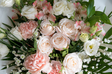 Floral arrangement in pastel colors. Bouquet of different flowers. peach fuzz - color of the year...