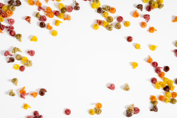 Dry pasta background texture. Italian pasta on white background. Food concept, menu design. Flat lay, top view, copy space