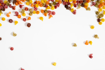 Dry pasta background texture. Italian pasta on white background. Food concept, menu design. Flat lay, top view, copy space