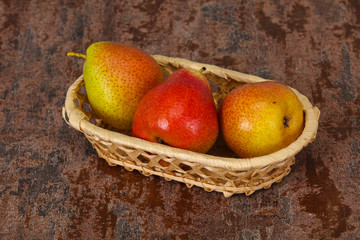 Pear heap in the wooden basket
