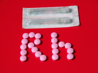 rhesus factor pills on a red background