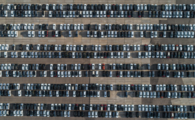 Top view of parking space with new cars lined up outside an automobile factory