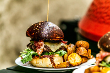 Sandwich hamburger with and mix of vegetables. Fast food. Delicious hamburger