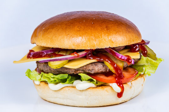 Sandwich hamburger with and mix of vegetables. Fast food. Delicious hamburger
