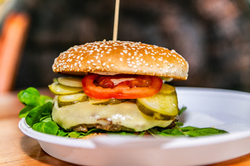 Sandwich hamburger with and mix of vegetables. Fast food. Delicious hamburger