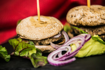 So delicious fresh mushroom burger with salad and onion. Fast food. Delicious hamburger