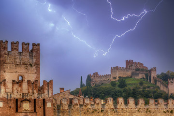 Medieval Castle of Soave in the province of Verona with thunder storm, Italy