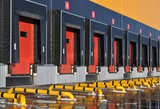 Front view of loading docks of a modern logistics center.