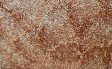 Slices of salami texture background