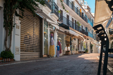 Obraz premium Marbella, Spain - August 26th, 2018. Typical old town street with Spanish architecture in Marbella, Costa del Sol, Andalusia, Spain, Europe